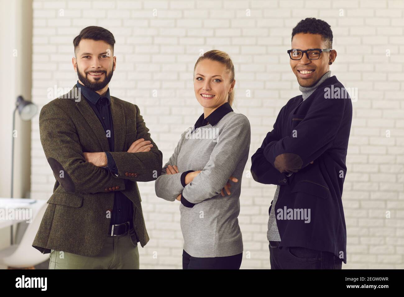 Multiethnic mixed race group of smiling business partners coworkers Stock Photo