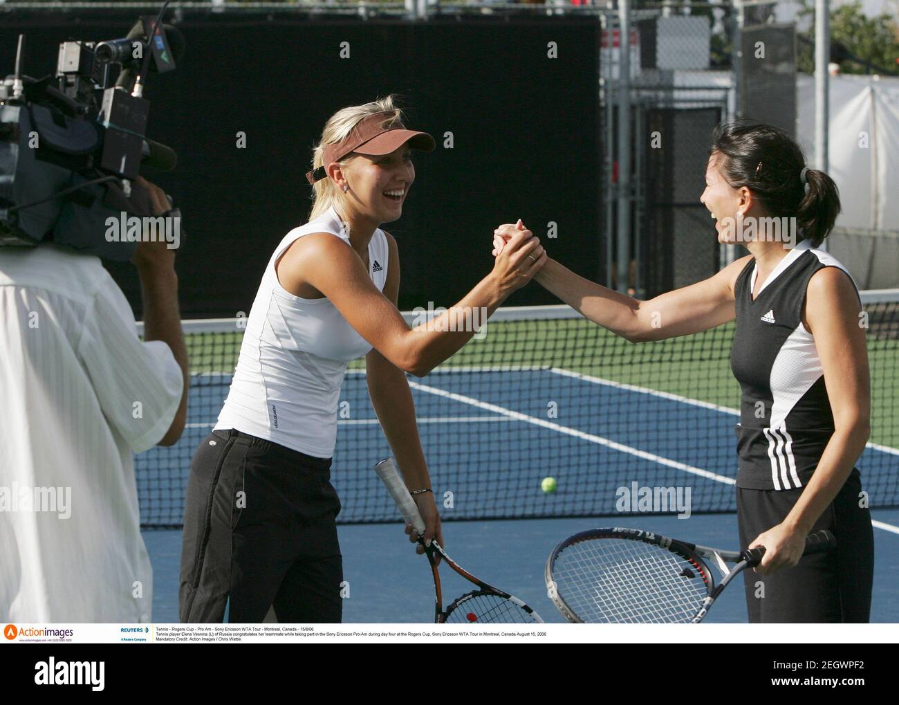 Tennis - Rogers Cup - Pro Am - Sony Ericsson WTA Tour - Montreal, Canada - 15/8/06  Tennis player Elena Vesnina (L) of Russia congratulates her teammate while taking part in the Sony Ericsson Pro-Am during day four at the Rogers Cup, Sony Ericsson WTA Tour in Montreal, Canada August 15, 2006  Mandatory Credit: Action Images / Chris Wattie Stock Photo
