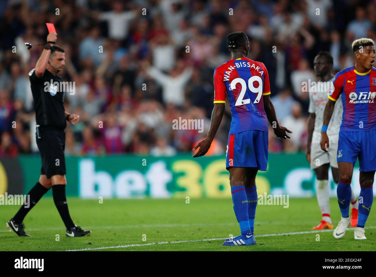 Soccer Football - Premier League - Crystal Palace v Liverpool - Selhurst Park, London, Britain - August 20, 2018 Crystal Palace's Aaron Wan-Bissaka is shown a red card by the referee after conceding a foul against Liverpool's Mohamed Salah (not pictured) REUTERS/Eddie Keogh EDITORIAL USE ONLY. No use with unauthorized audio, video, data, fixture lists, club/league logos or "live" services. Online in-match use limited to 75 images, no video emulation. No use in betting, games or single club/league/player publications. Please contact your account representative for furt Stock Photo