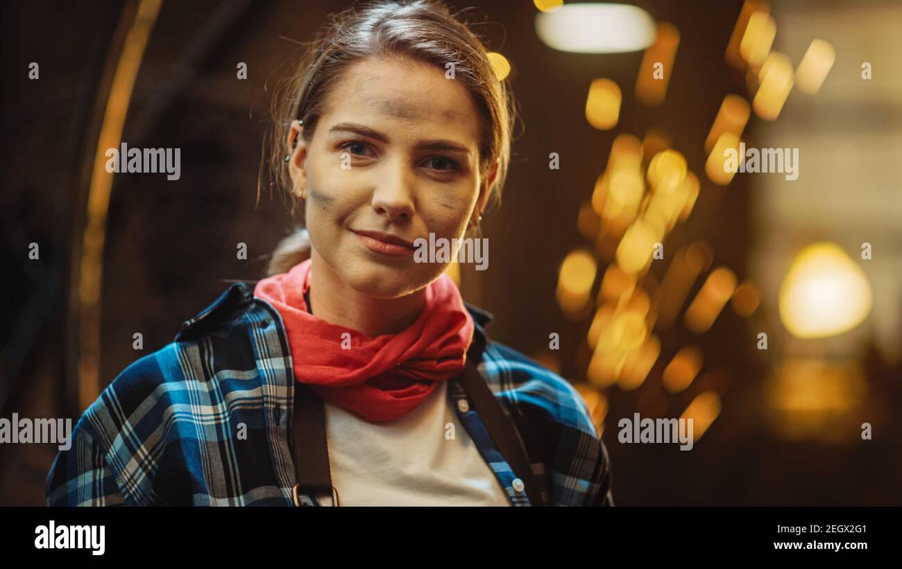 Young Beautiful Empowering Woman with Ear Piercing Gently Smiles at the