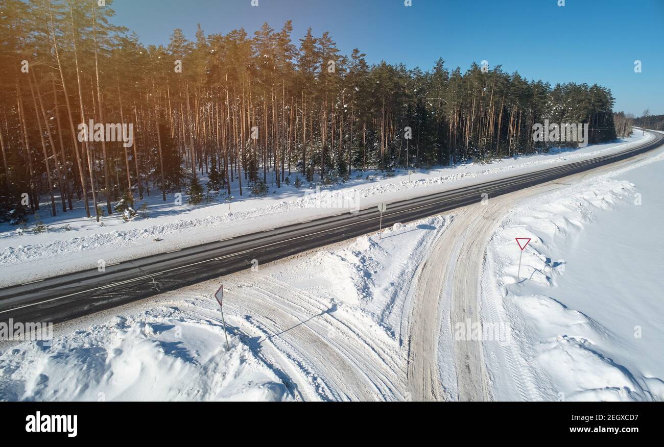 Road intersection on winter time aerial drone view Stock Photo