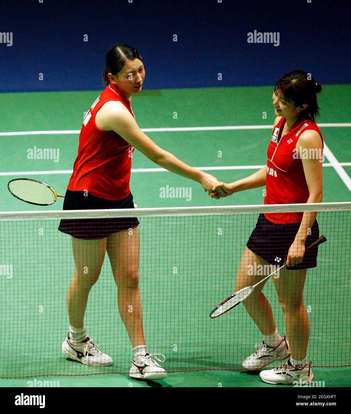 Badminton - Yonex All-England Open Championships - National Indoor Arena,  Birmingham - 6/3/08 Japan's Kumiko Ogura (L) and Reiko Shiota celebrate  victory during the second round of the Women's doubles Mandatory Credit: