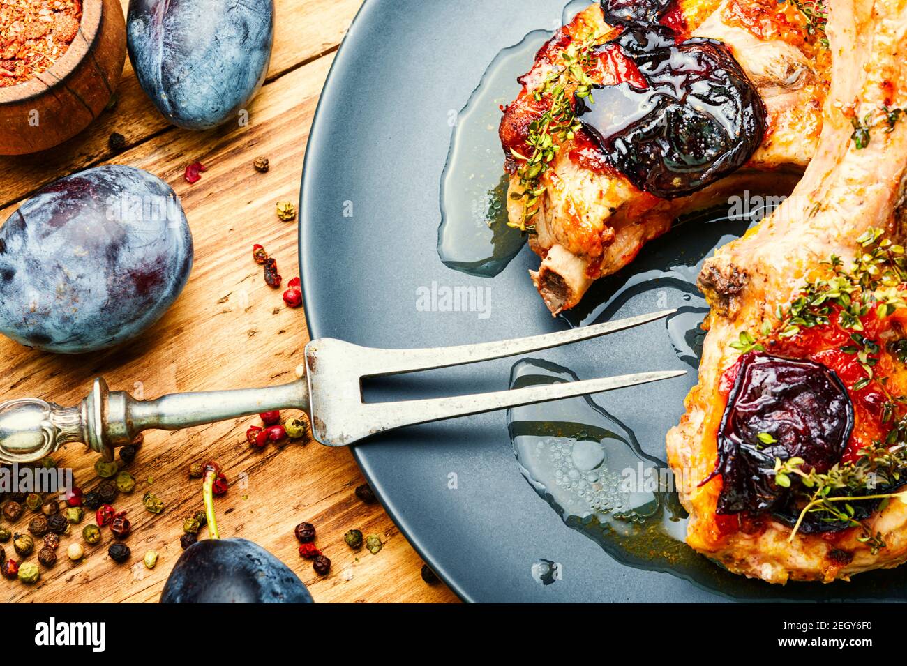 Appetizing pork steak cooked in plum sauce Stock Photo