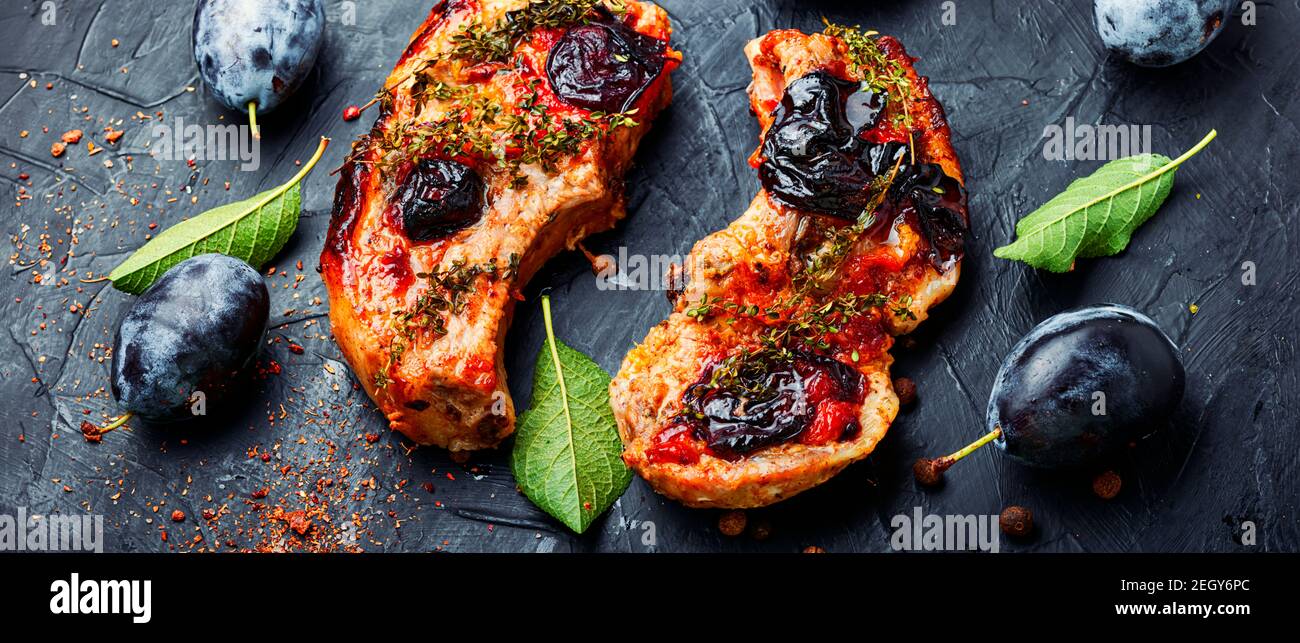 Appetizing pork steak cooked in plum sauce Stock Photo