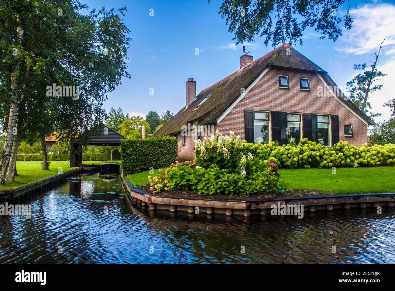 Giethoorn is a town in the province of Overijssel, Netherlands It is located in the municipality of Steenwijkerland, about 5 km southwest of Steenwijk Stock Photo