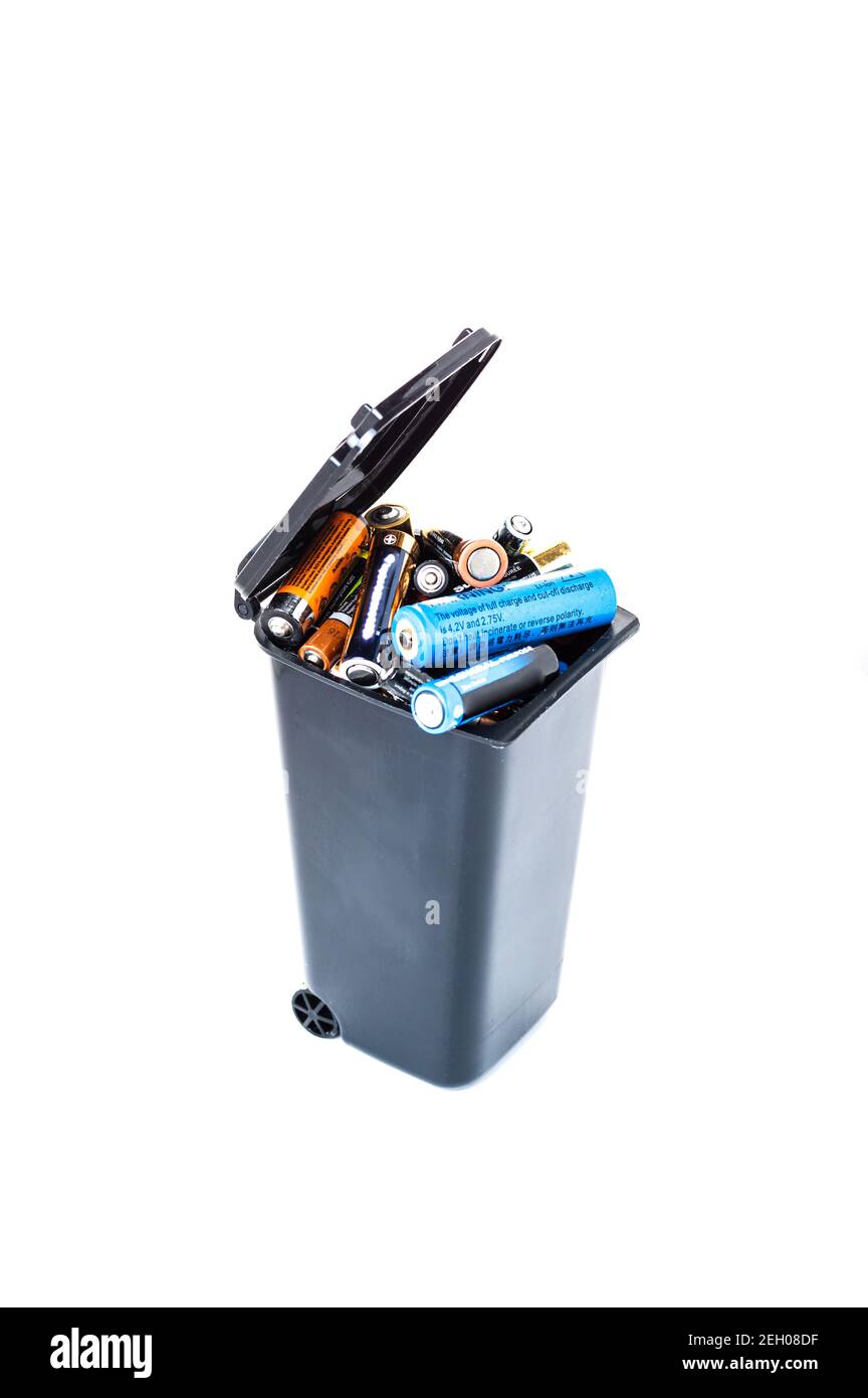 Old, bad batteries. Waste sorting. Used batteries in the trash. Isolate. Vertical frame Stock