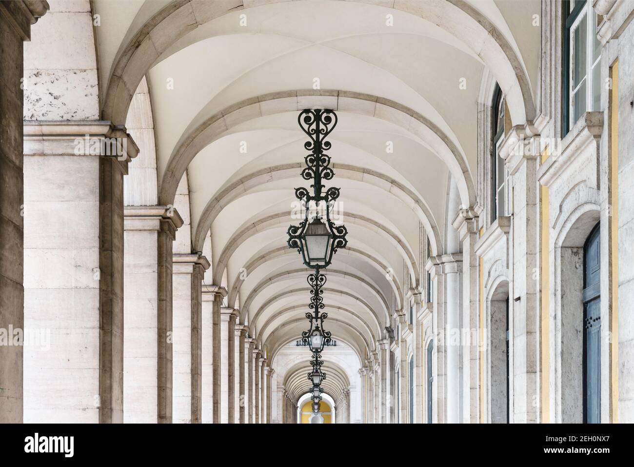 Hallway with columns surrounding the Commerce Square in Lisbon, Portugal Stock Photo