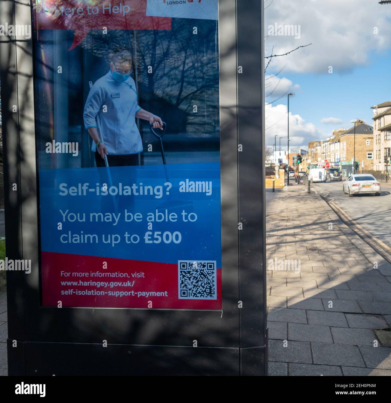 A government Covid-19 information billboard on the street offering financial help for people self isolating during the national lockdown. Stock Photo