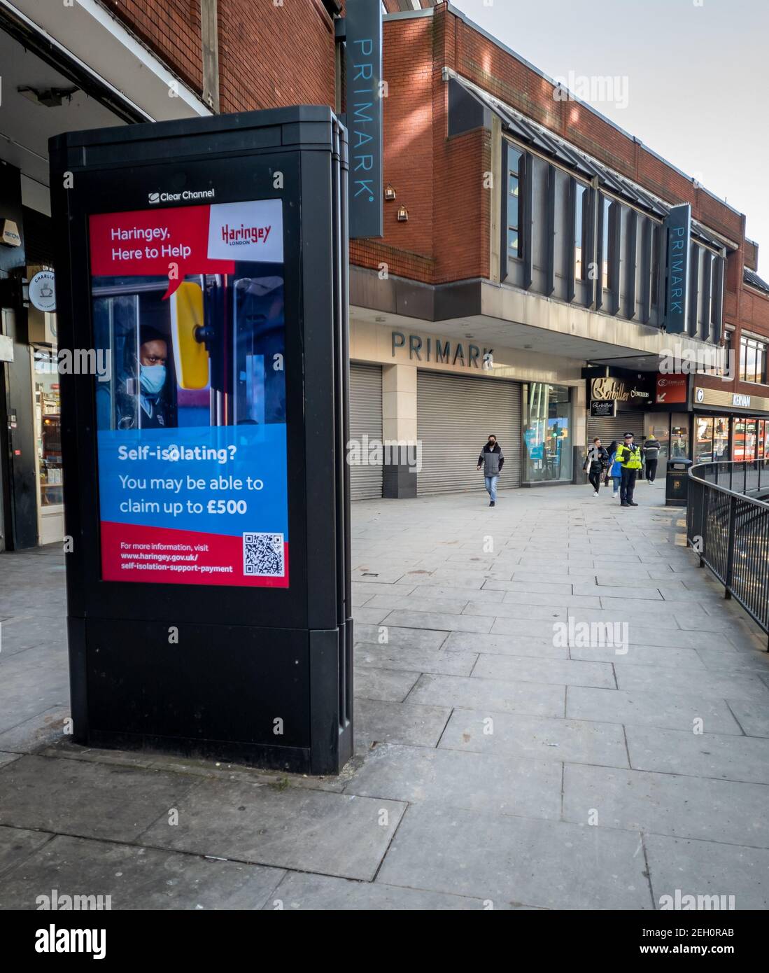 A government Covid-19 information billboard on the high street offering financial support for people self isolating during the national lockdown. Stock Photo