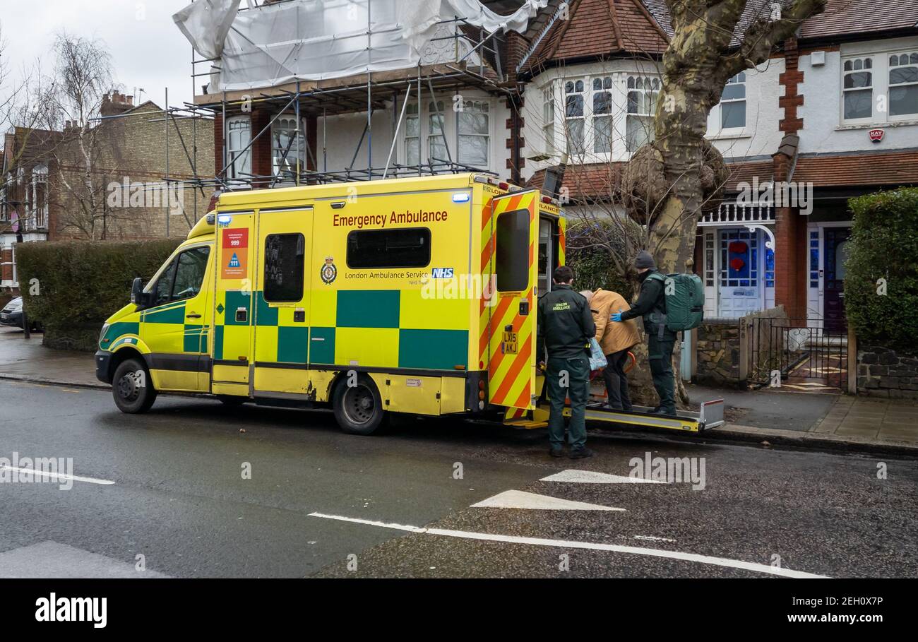 A NHS emergency ambulance on call out with its crew of paramedics