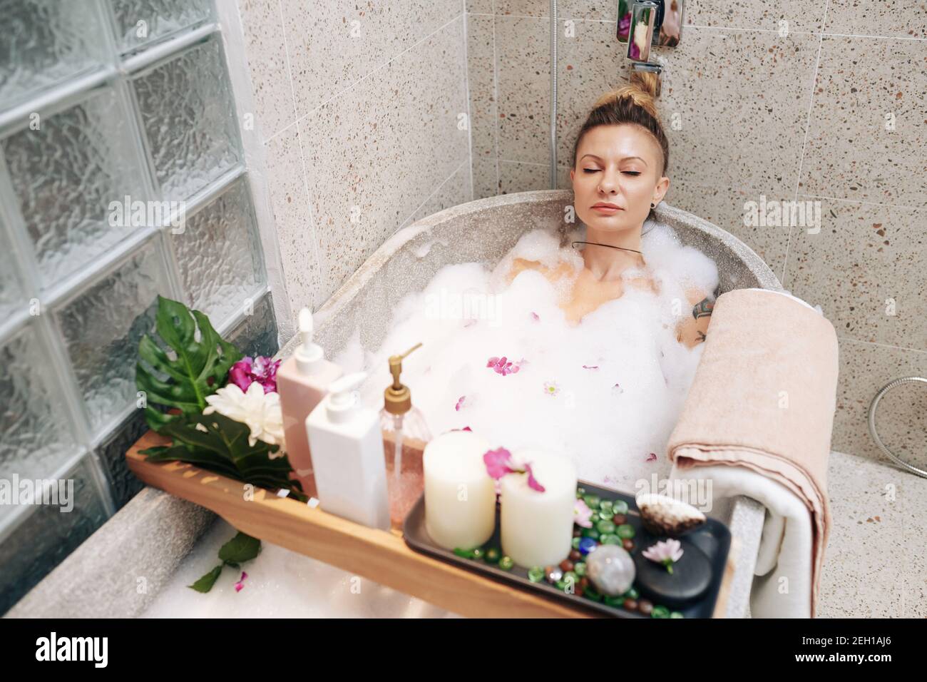 Woman taking bubble bath Stock Photo Alamy