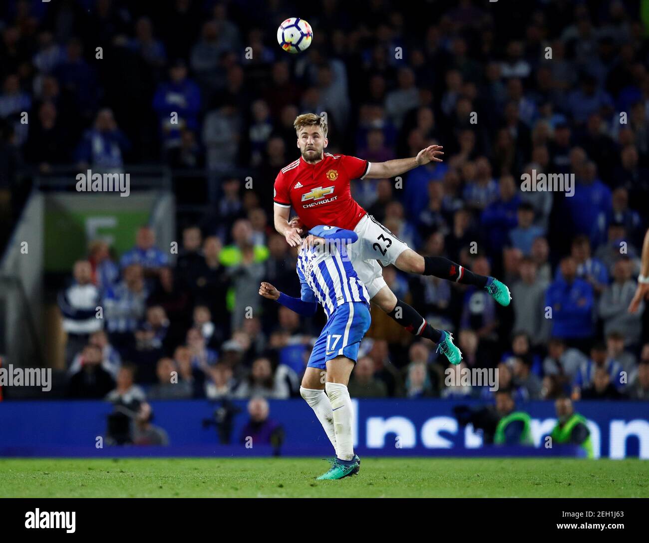 Soccer Football - Premier League - Brighton & Hove Albion v Manchester United - The American Express Community Stadium, Brighton, Britain - May 4, 2018   Manchester United's Luke Shaw in action with Brighton's Glenn Murray    REUTERS/Eddie Keogh    EDITORIAL USE ONLY. No use with unauthorized audio, video, data, fixture lists, club/league logos or 'live' services. Online in-match use limited to 75 images, no video emulation. No use in betting, games or single club/league/player publications.  Please contact your account representative for further details. Stock Photo
