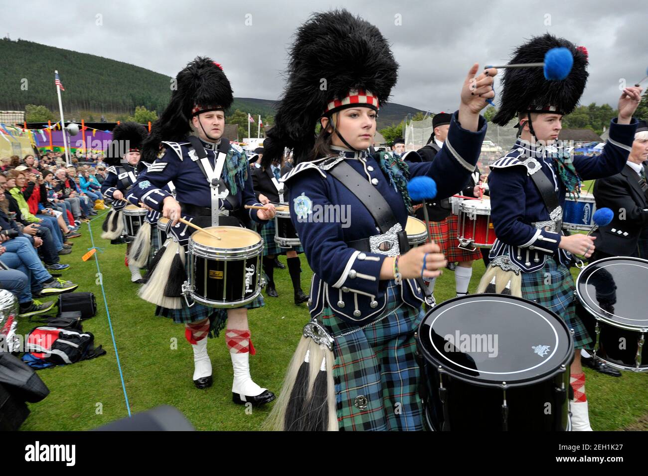 Pipes and drums on parade at Ballater Highland Games, Monaltrie Park, Ballater, Royal Deeside, Aberdeenshire. Stock Photo