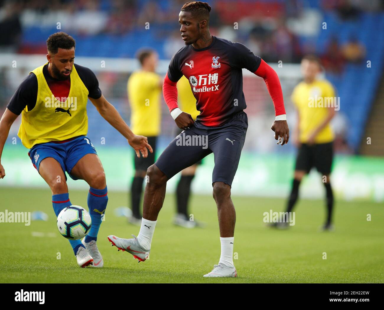 Soccer Football - Premier League - Crystal Palace v Liverpool - Selhurst Park, London, Britain - August 20, 2018  Crystal Palace's Andros Townsend and Wilfried Zaha during the warm up       Action Images via Reuters/John Sibley  EDITORIAL USE ONLY. No use with unauthorized audio, video, data, fixture lists, club/league logos or 'live' services. Online in-match use limited to 75 images, no video emulation. No use in betting, games or single club/league/player publications.  Please contact your account representative for further details. Stock Photo
