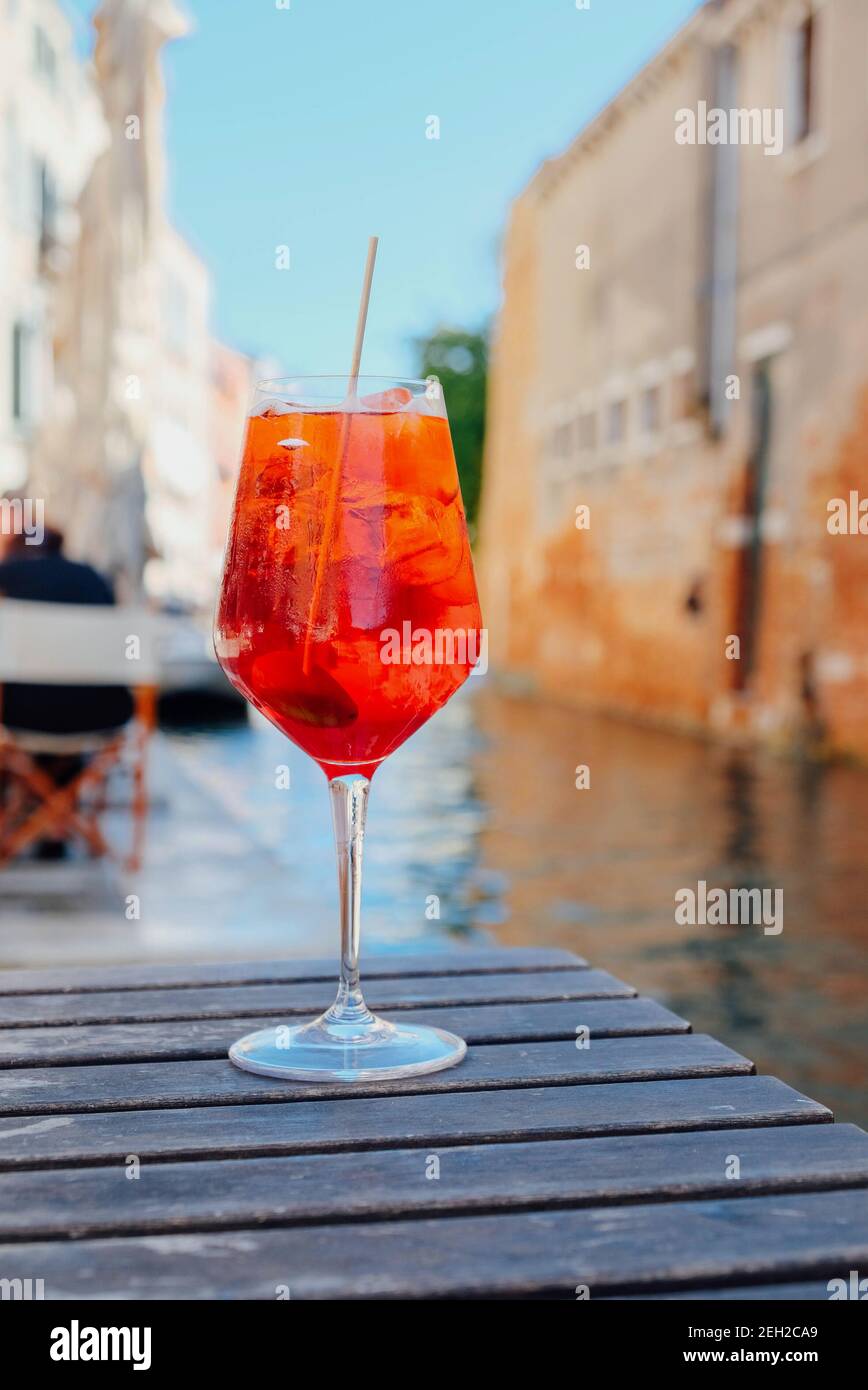 Glass of refreshing Aperol Spritz cocktail served on the deck bar in