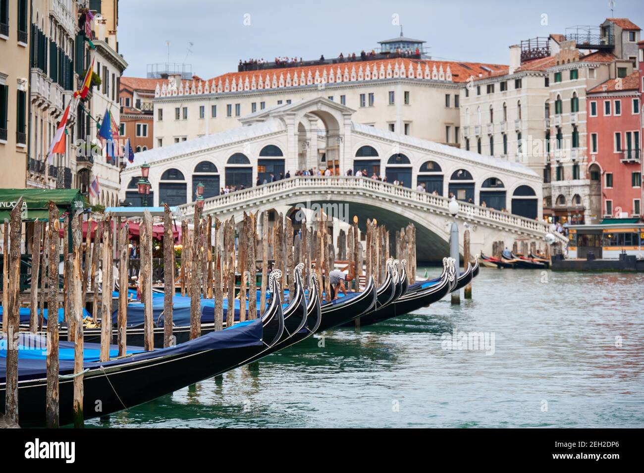 Rialto Bridge and gondolas seen from boat, Venice, Veneto, Italy Stock Photo