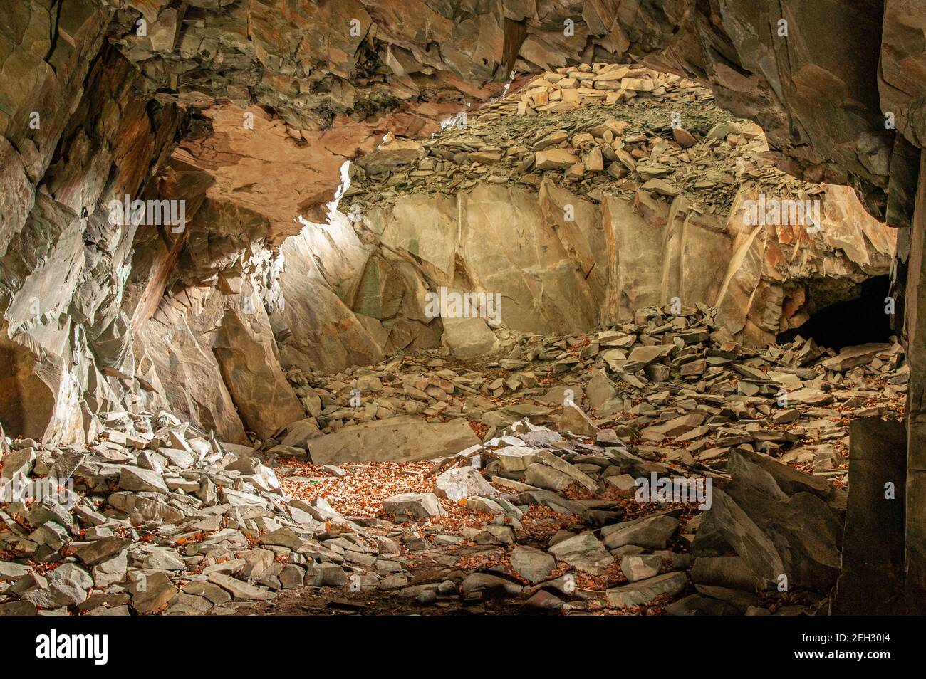 Inside slate cave with colours Stock Photo