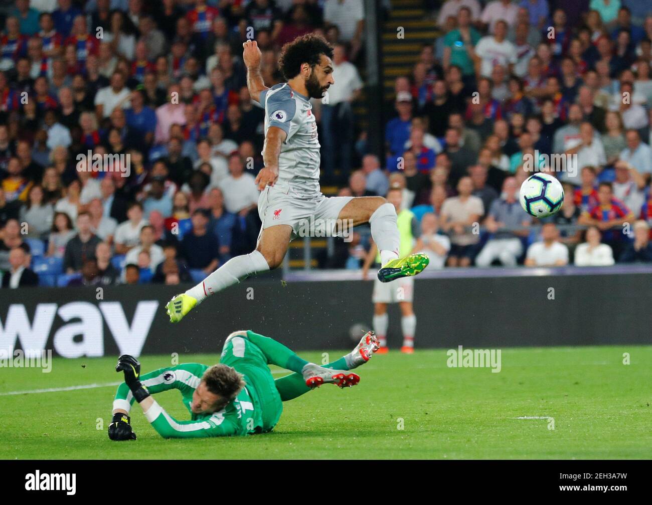 Soccer Football - Premier League - Crystal Palace v Liverpool - Selhurst Park, London, Britain - August 20, 2018  Liverpool's Mohamed Salah in action with Crystal Palace's Wayne Hennessey                     REUTERS/Eddie Keogh  EDITORIAL USE ONLY. No use with unauthorized audio, video, data, fixture lists, club/league logos or 'live' services. Online in-match use limited to 75 images, no video emulation. No use in betting, games or single club/league/player publications.  Please contact your account representative for further details. Stock Photo