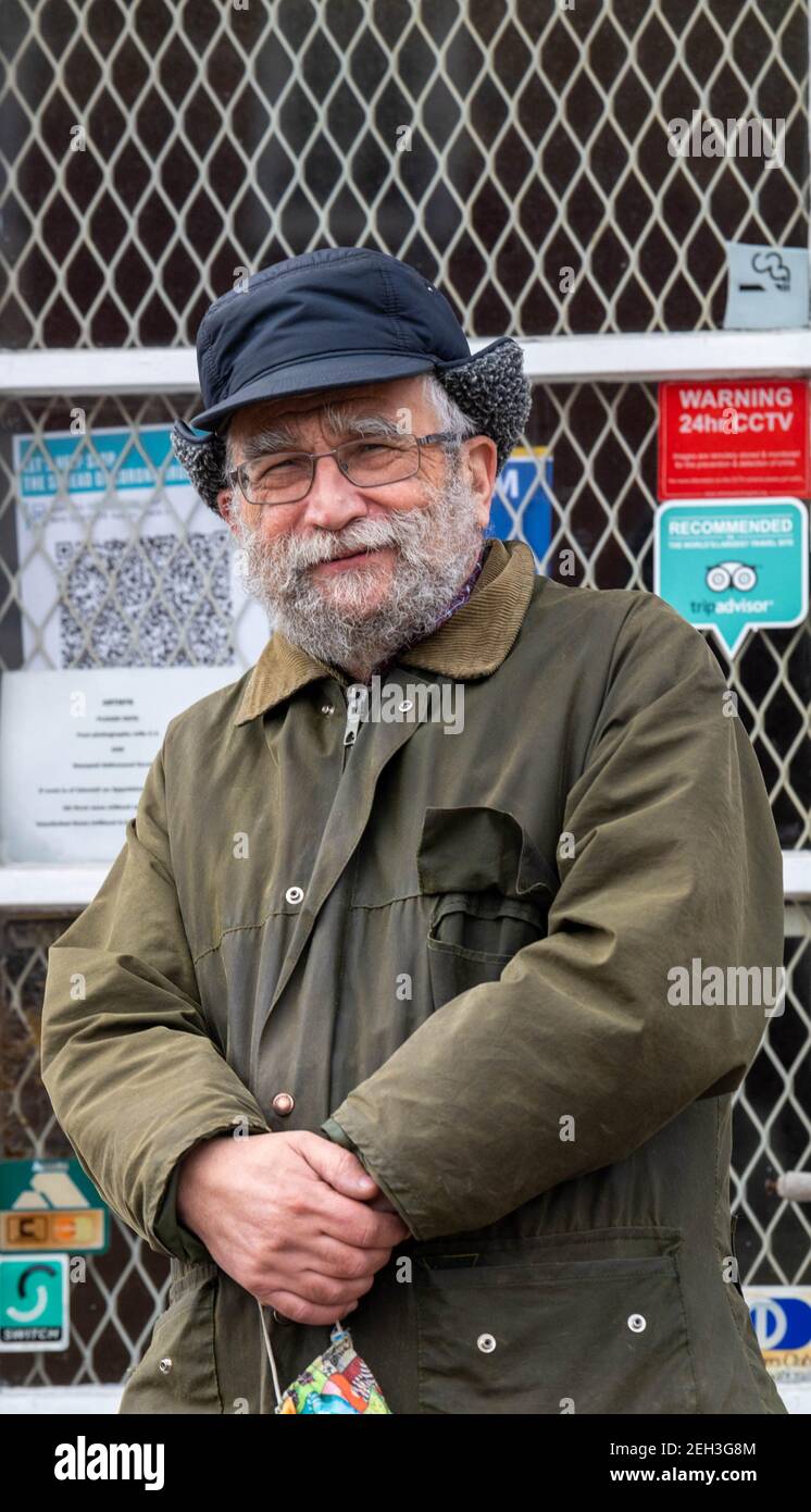 Brentwood Essex 19th February 2021 John Brandler, the art dealer who purchased the Banksey mural, titled girl hula-hooping with a bicycle tyre has been subject to abuse after he removed the it from the wall it had been painted on in Nottingham in order to preserve it. Mr Brandler, pictured outside his art gallary in Brentwood Essex, said that he had been called a Nazi, a thief and a handler of stolen property and other abuse. He said the mural had been offered to community bodies in Nottingham but none had been interested. Credit: Ian Davidson/Alamy Live News Stock Photo