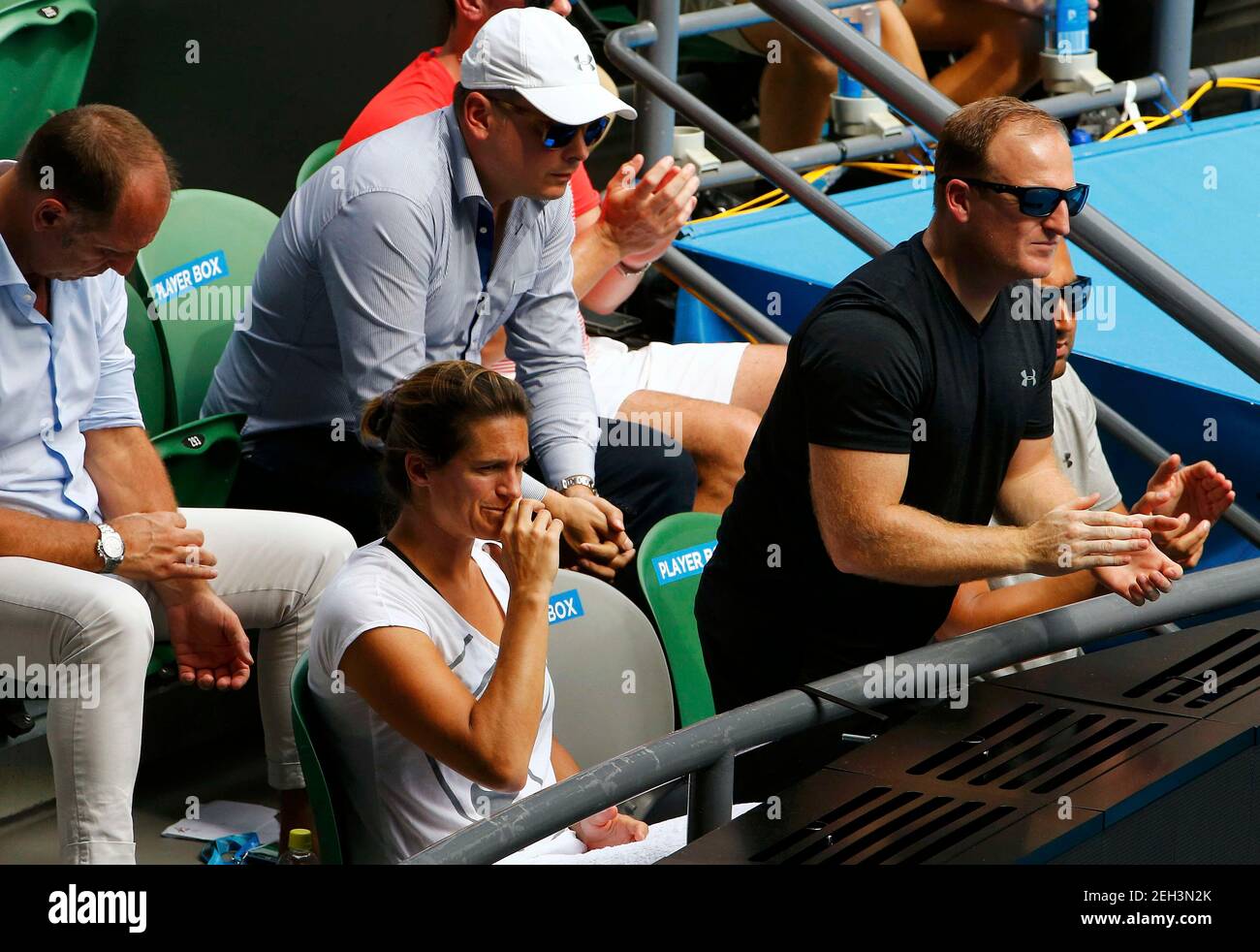 Amelie Mauresmo (L), coach fo Britain's Andy Murray, reacts in the player's  box as she watches his quarter-final match against Spain's David Ferrer at  the Australian Open tennis tournament at Melbourne Park,