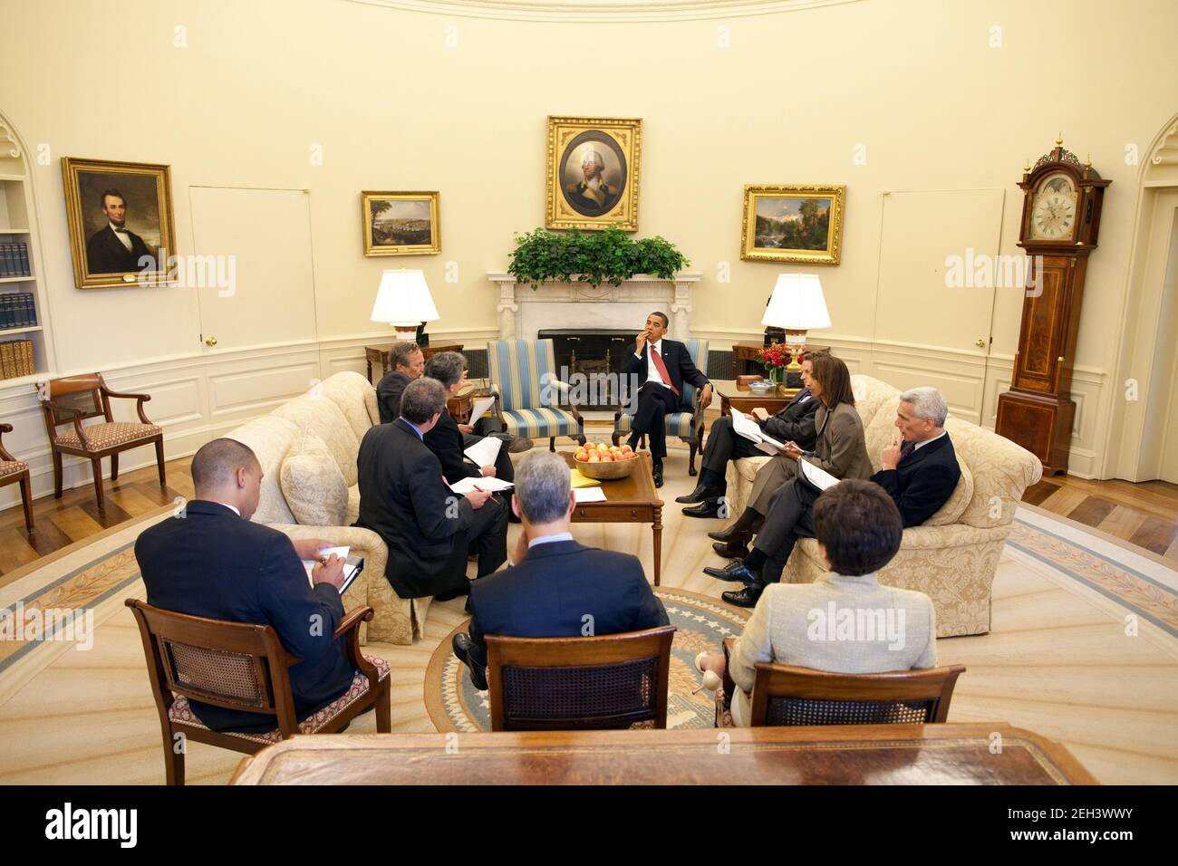 President Barack Obama receives the daily economic briefing in the Oval ...
