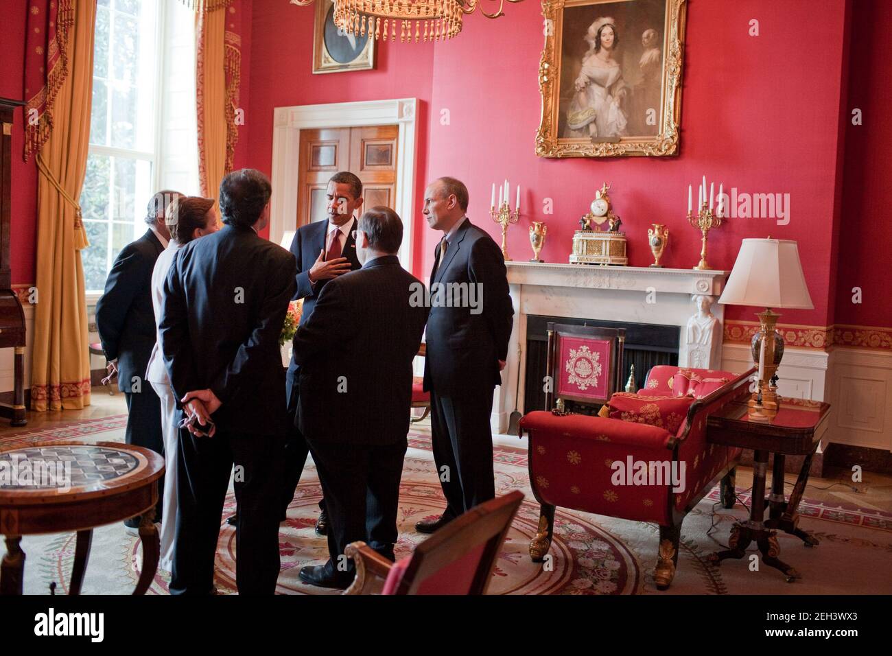 President Barack Obama and Assistant to the President for Legislative Affairs Phil Schiliro, right, talk with others in the Red Room following a reception for Supreme Court Justice Sonia Sotomayor at the White House, August 12, 2009. Stock Photo