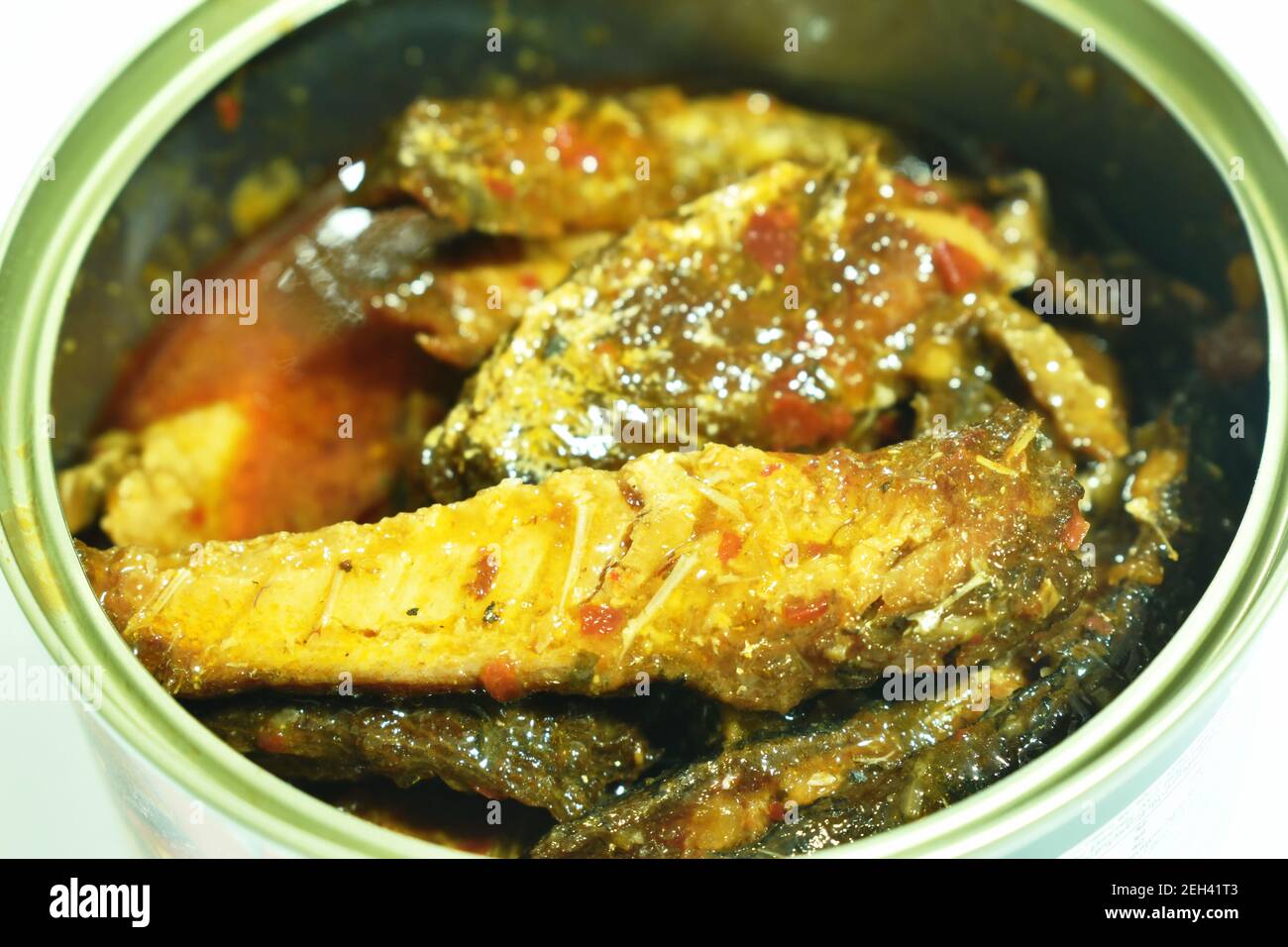 spicy sardines or mackerel fish in tin can on white background Stock