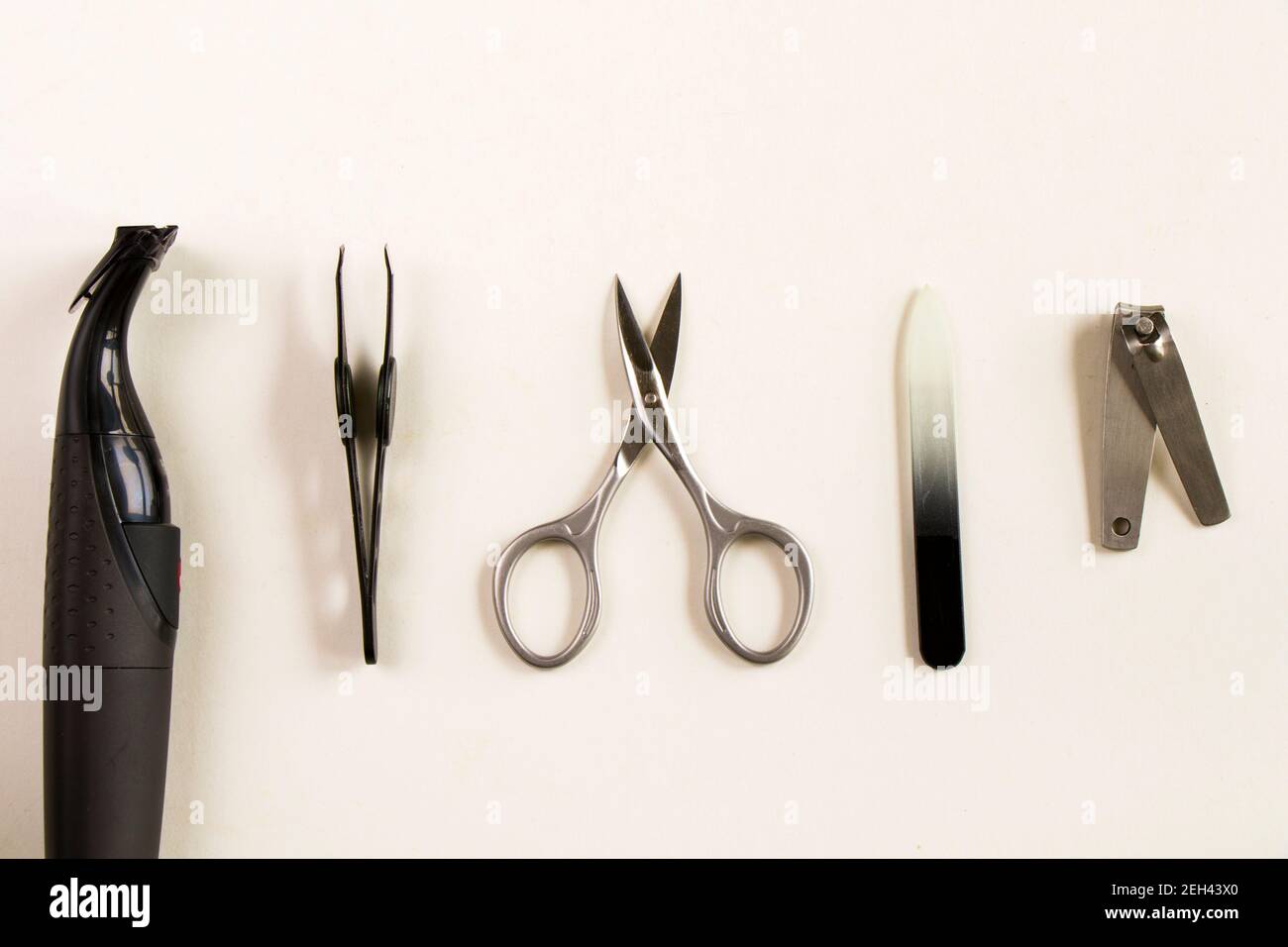 Scissors and other instruments for nails on the white background Stock Photo