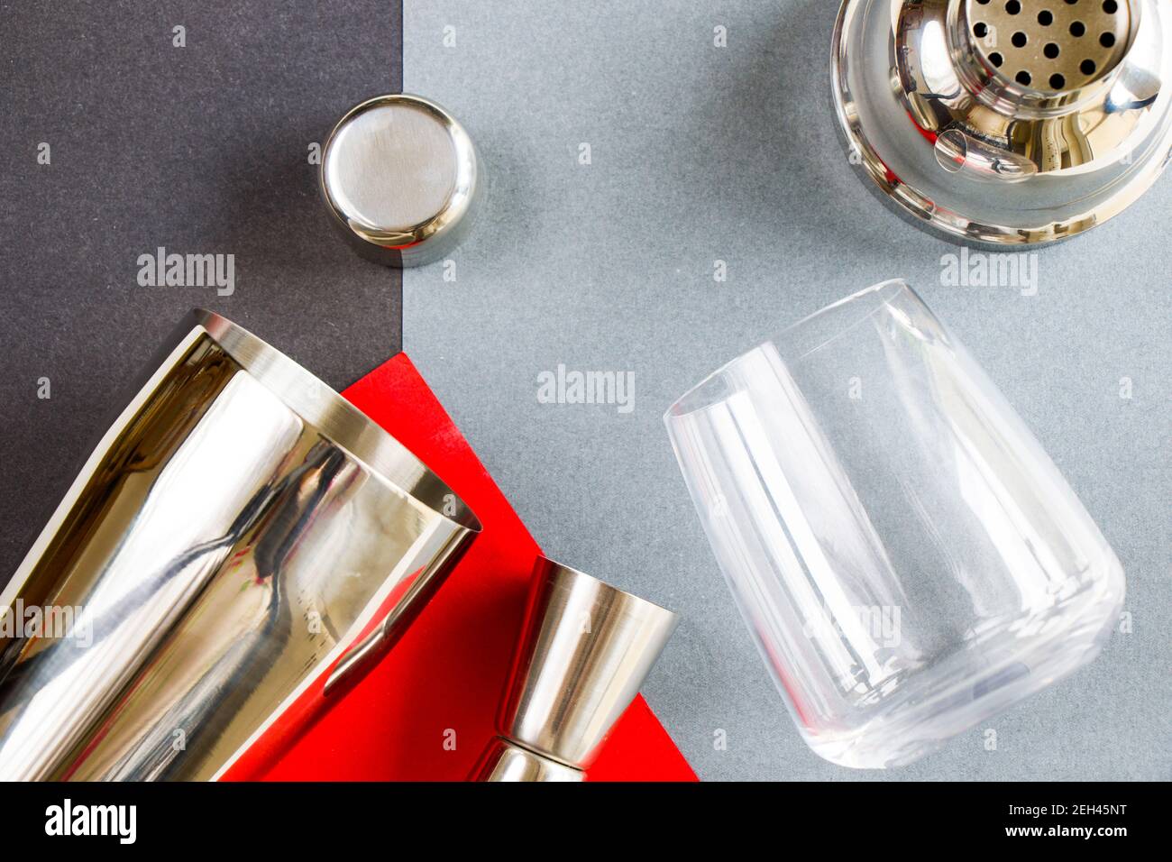 Barmen mixer and shaker, metal accessory, drink mixer on the gray and red background Stock Photo