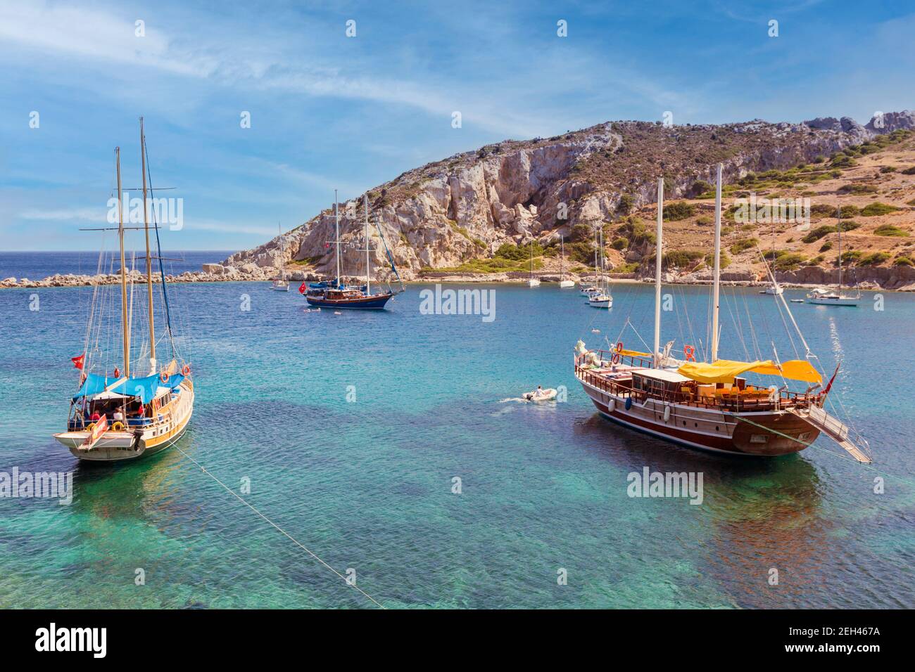 Kindos, Datca Peninsula, Mugla Province, Aegean Region,Turkey.  Yachts moored in bay in front of town. Stock Photo