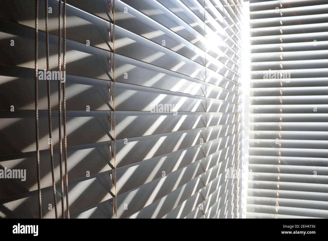 Bright sunshine seen through venetian blinds Stock Photo