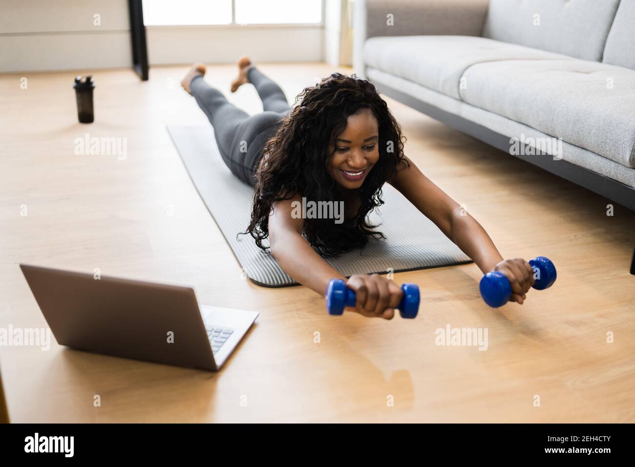 Online TV Home Fitness Workout And Exercise Stock Photo