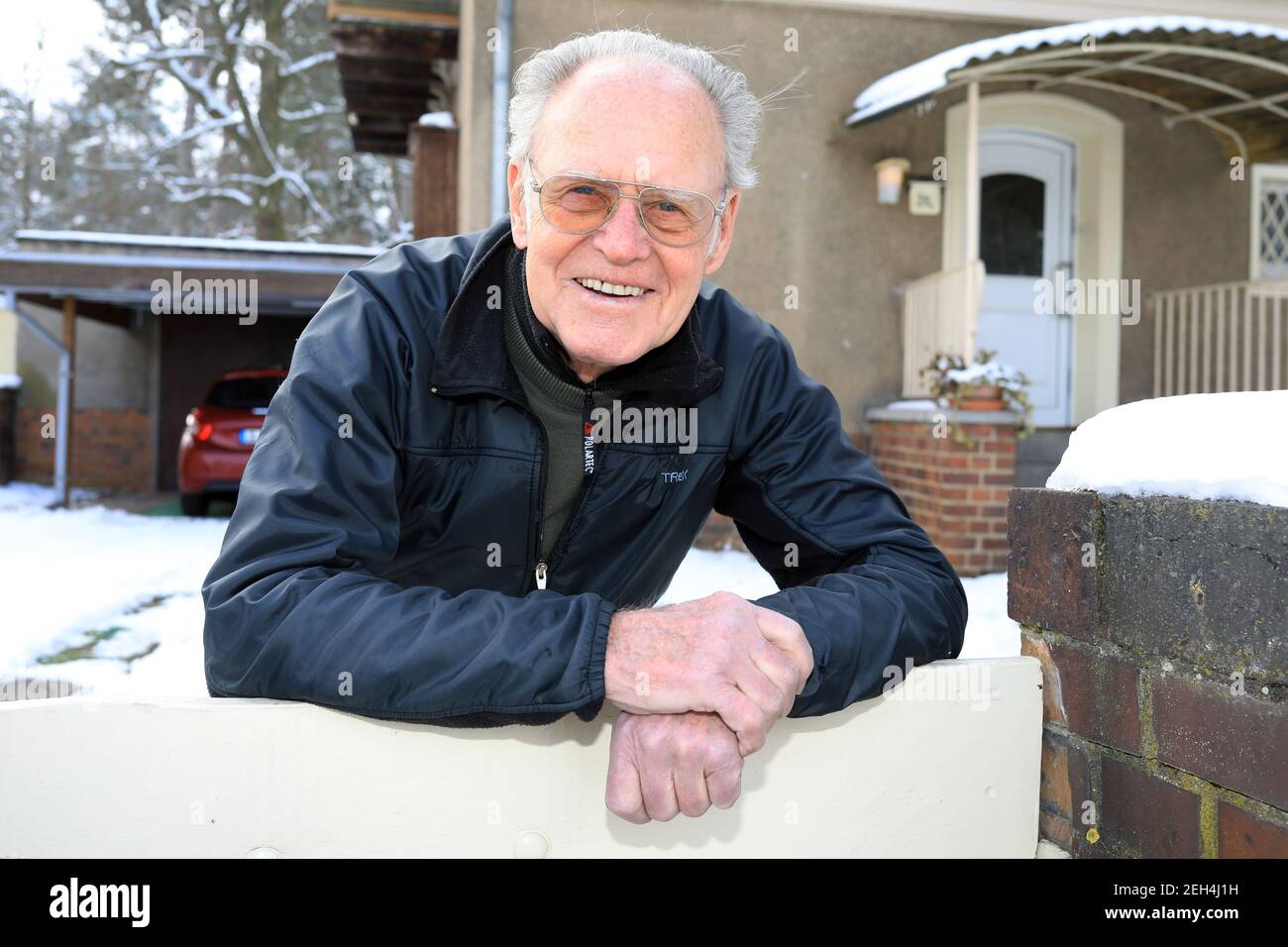 01 February 2021, Saxony-Anhalt, Heyrothsberge: Cycling legend Gustav-Adolf Schur stands in front of his house in Heyrothsberge. Schur will be 90 years old on 23.02.2021. In his active time, 'Täve' triggered true storms of enthusiasm. Millions of people lined the streets when the nine-time GDR Sportsman of the Year and his team colleagues roared past on their racing bikes. Between 1950 and 1964, he celebrated successes that were unique in amateur sport. In 1955, the Heyrothsberg native became the first German rider to win the prestigious Peace Tour. Photo: Peter Gercke/dpa-Zentralbild/ZB Stock Photo