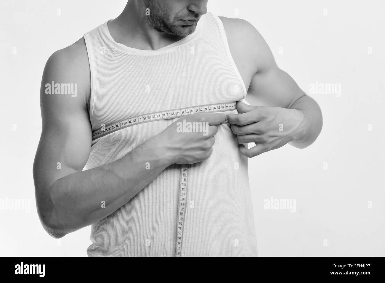 Man measuring biceps tape measure hi-res stock photography and images -  Alamy