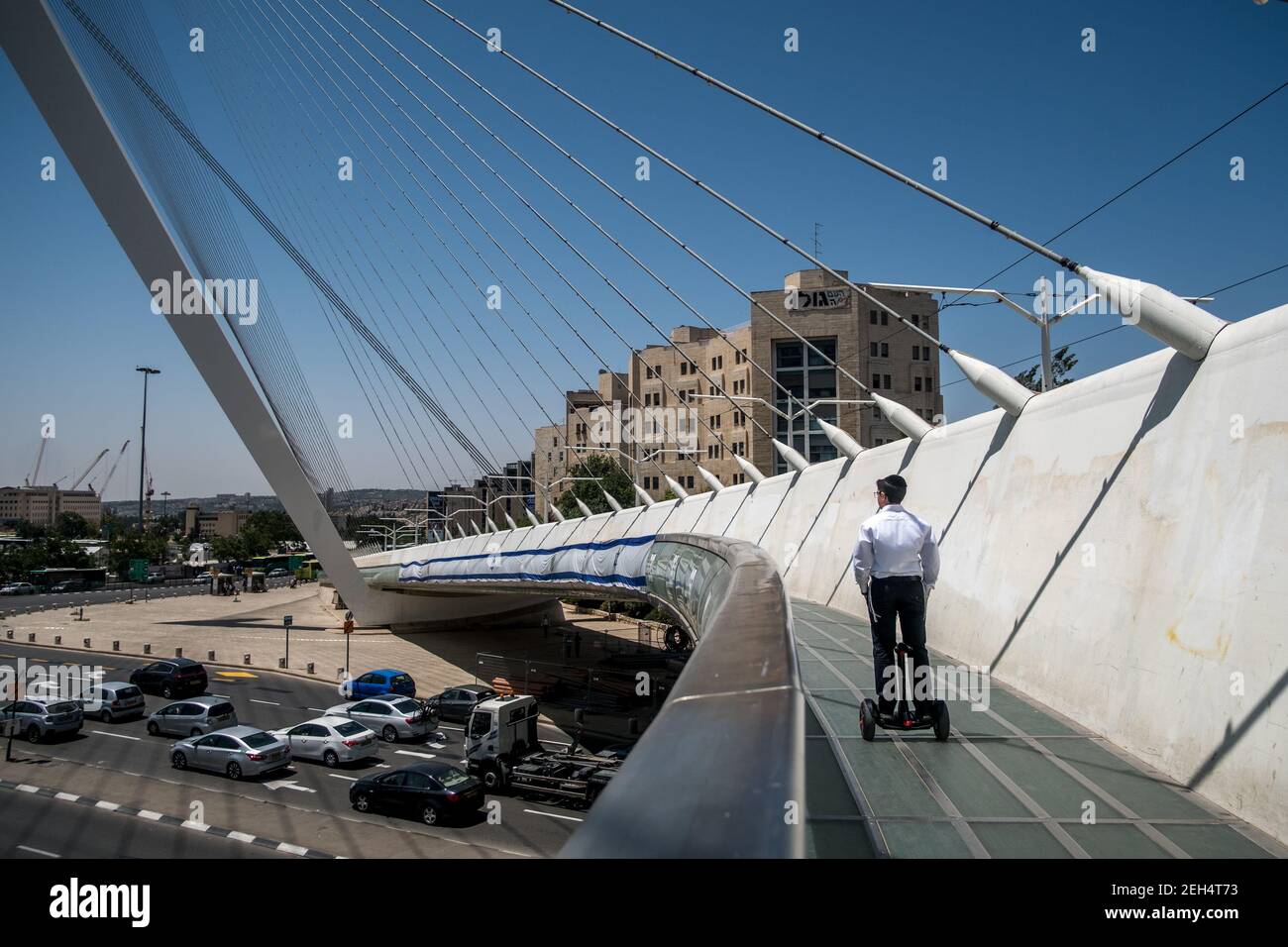 The Cordes Bridge. This one is now part of the jerusalemite landscape. With its steel cables connecting the structure to a sort of mast, the futuristic work of Spanish architect Santiago Calatrava allows the tramway to cross a busy intersection in Jerusalem, on the road leading to Tel Aviv. A footbridge with glass railing adjacent to the tramway has been provided for pedestrians. May 17, 2018. Jerusalem. Israel. Stock Photo