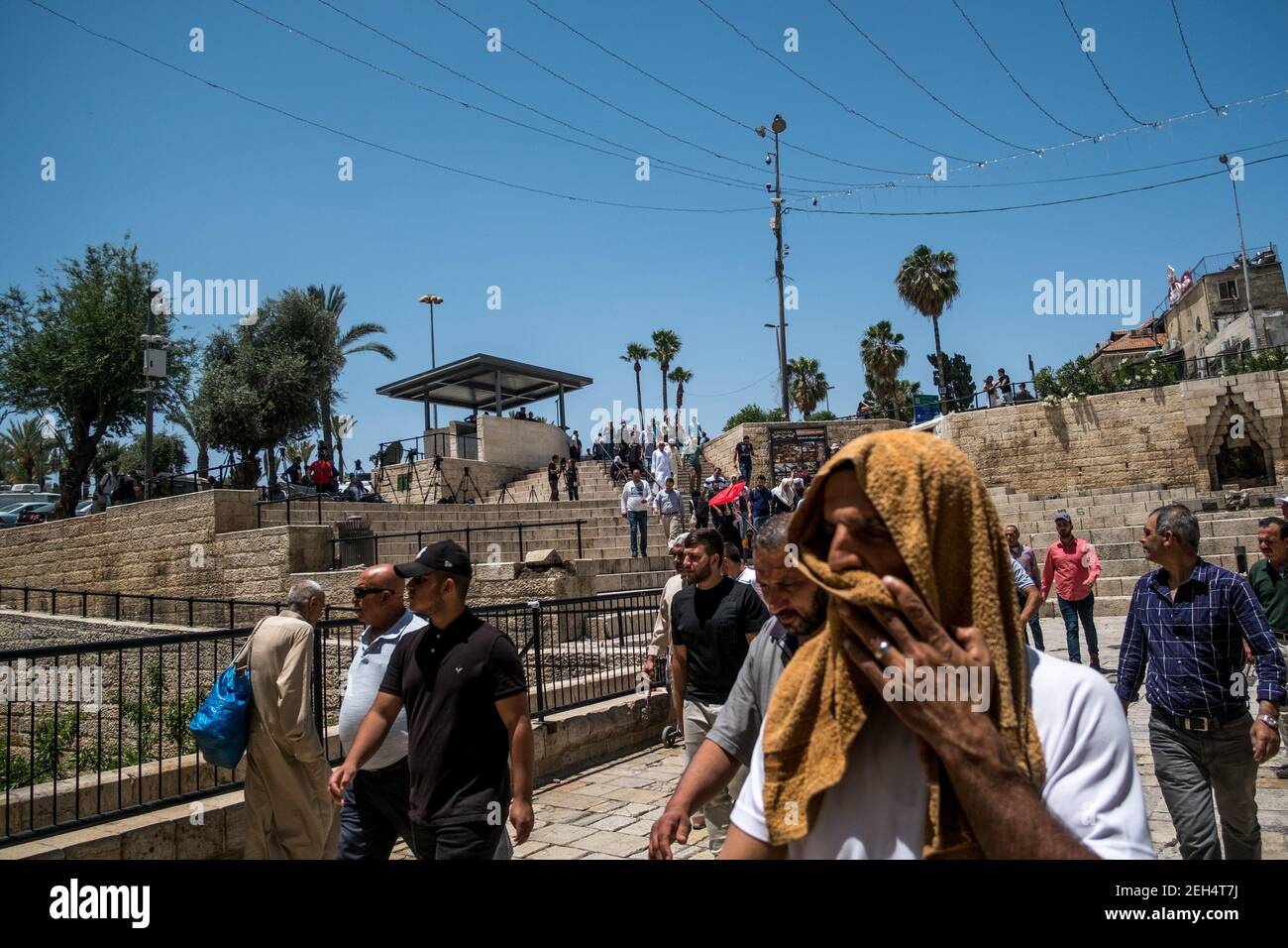 Many Muslims head towards the Damascus Gate to go to the mosque for Friday prayers. The Damascus Gate is the gateway to the Muslim quarter of the Old City. May 18, 2018. Jerusalem. Israel. Stock Photo