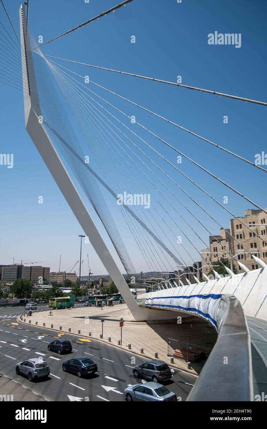 The Cordes Bridge. This one is now part of the jerusalemite landscape. With its steel cables connecting the structure to a sort of mast, the futuristic work of Spanish architect Santiago Calatrava allows the tramway to cross a busy intersection in Jerusalem, on the road leading to Tel Aviv. A footbridge with glass railing adjacent to the tramway has been provided for pedestrians. May 17, 2018. Jerusalem. Israel. Stock Photo