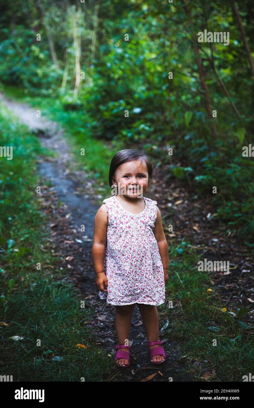 Little girl walking in the park Stock Photo