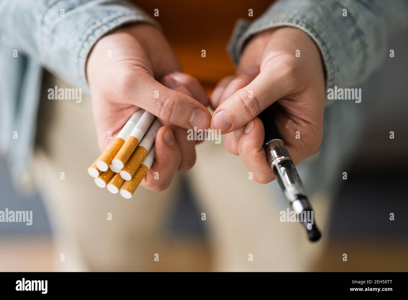 Smoking Tobacco E Cigarette. Holding Tobacco Vape Stock Photo