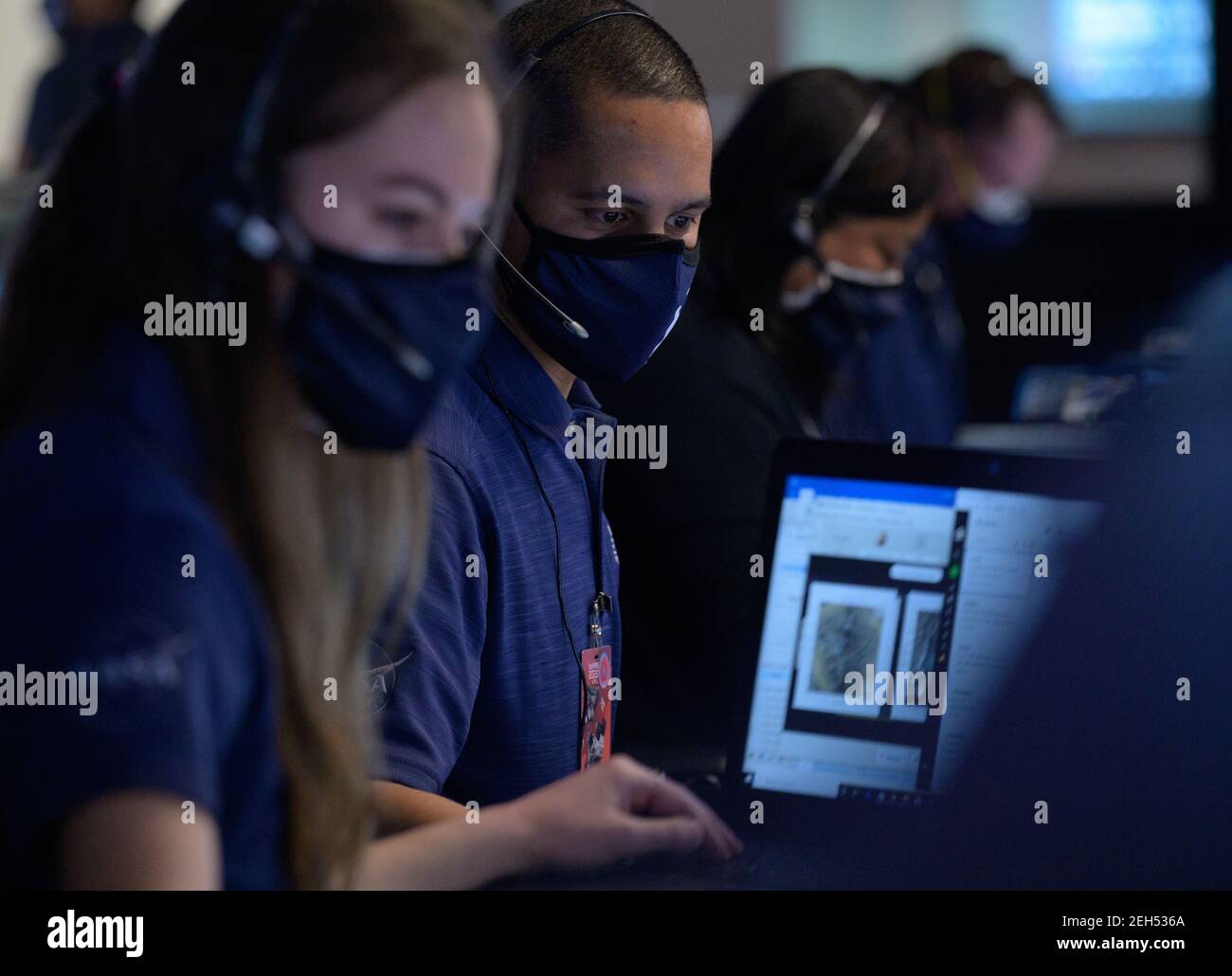 Pasadena, United States Of America. 18th Feb, 2021. Members of the NASA Perseverance Mars rover mission team watch data on monitors during the landing phase in mission control at the NASA Jet Propulsion Laboratory February 18, 2021 in Pasadena, California. The Perseverance Mars rover landed successfully and immediately began sending images from the surface of the Red Planet. Credit: Planetpix/Alamy Live News Stock Photo