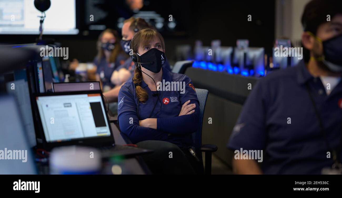 Pasadena, United States Of America. 18th Feb, 2021. Members of the NASA Perseverance Mars rover mission team watch data on monitors during the landing phase in mission control at the NASA Jet Propulsion Laboratory February 18, 2021 in Pasadena, California. The Perseverance Mars rover landed successfully and immediately began sending images from the surface of the Red Planet. Credit: Planetpix/Alamy Live News Stock Photo