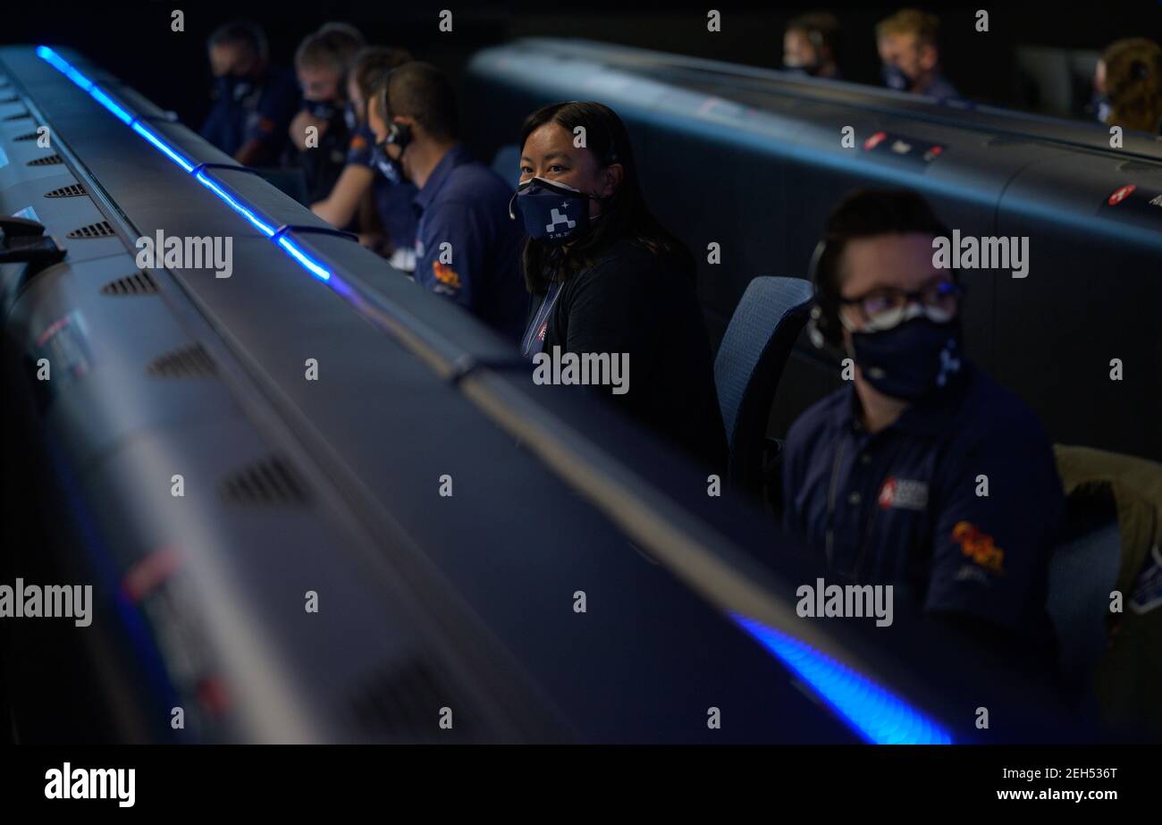 Pasadena, United States Of America. 18th Feb, 2021. Members of the NASA Perseverance Mars rover mission team watch data on monitors during the landing phase in mission control at the NASA Jet Propulsion Laboratory February 18, 2021 in Pasadena, California. The Perseverance Mars rover landed successfully and immediately began sending images from the surface of the Red Planet. Credit: Planetpix/Alamy Live News Stock Photo