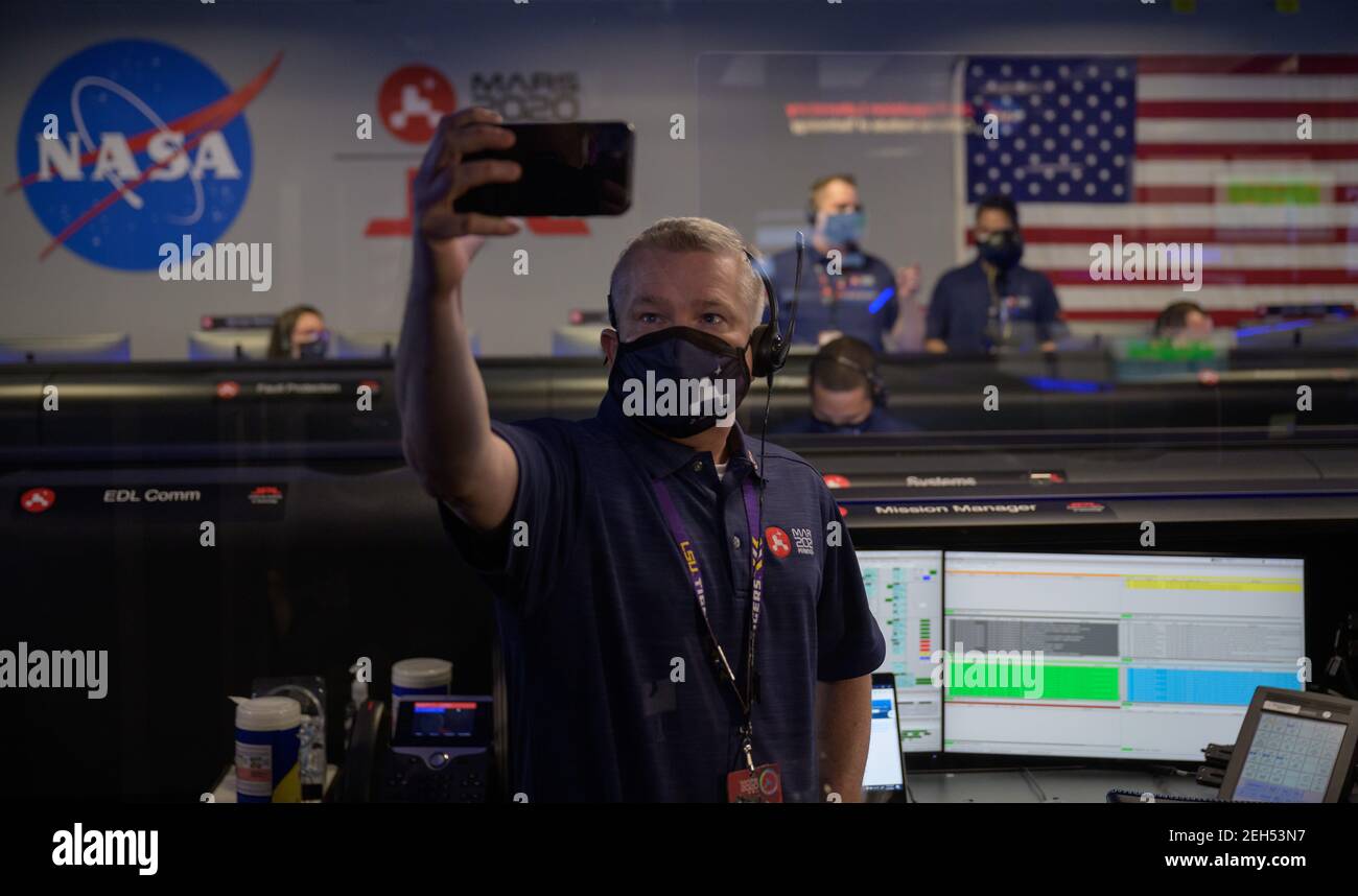 Pasadena, United States Of America. 18th Feb, 2021. Perseverance mission manager Keith Comeaux takes a selfie during the landing phase of the NASA Perseverance Mars rover in mission control at the NASA Jet Propulsion Laboratory February 18, 2021 in Pasadena, California. The Perseverance Mars rover landed successfully and immediately began sending images from the surface of the Red Planet. Credit: Planetpix/Alamy Live News Stock Photo