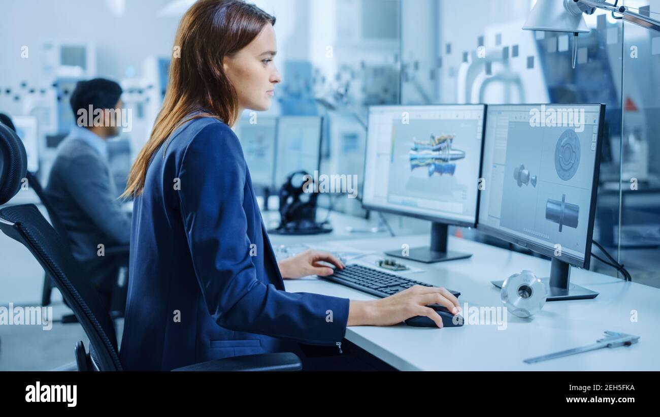 Over the Shoulder: Team of Mechanical Engineer Working on Personal ...