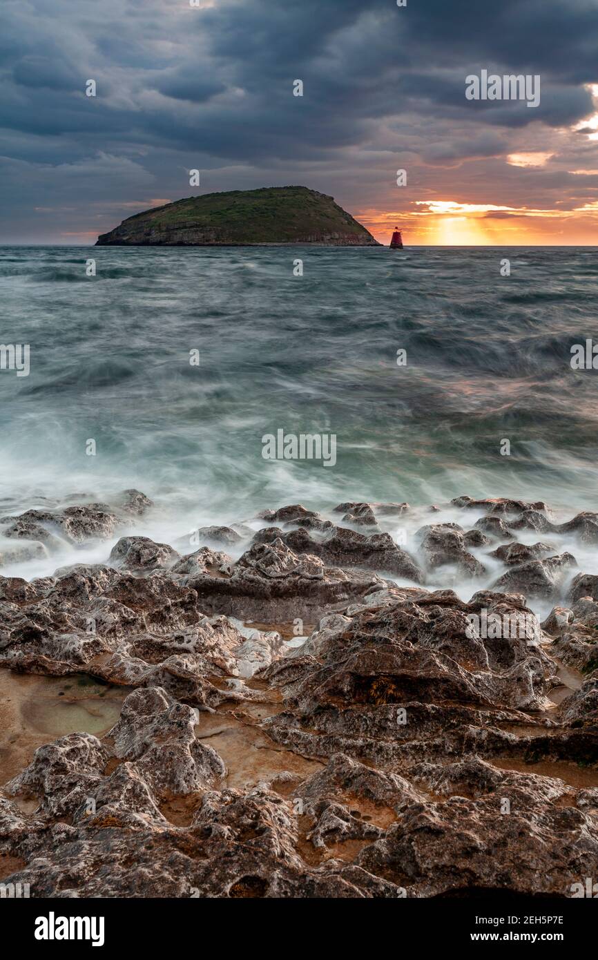 Puffin Island under stormy skies, Anglesey, North Wales Stock Photo