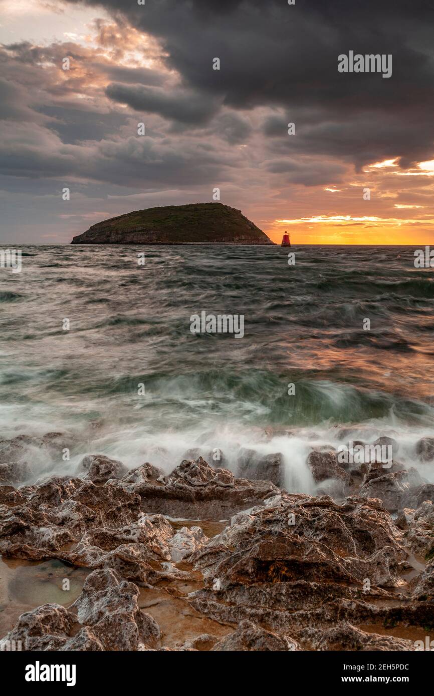 Puffin Island under stormy skies, Anglesey, North Wales Stock Photo