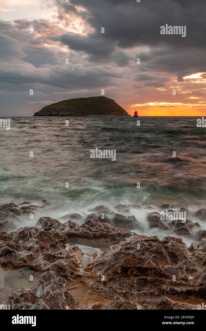 Puffin Island under stormy skies, Anglesey, North Wales Stock Photo
