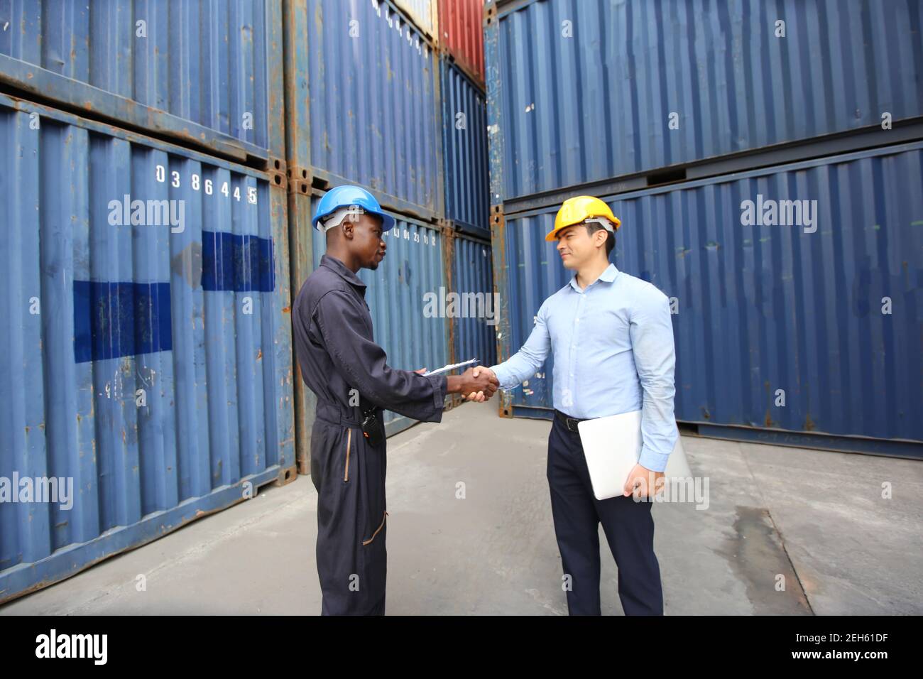 Engineer or supervisor checking and control loading Containers box from ...
