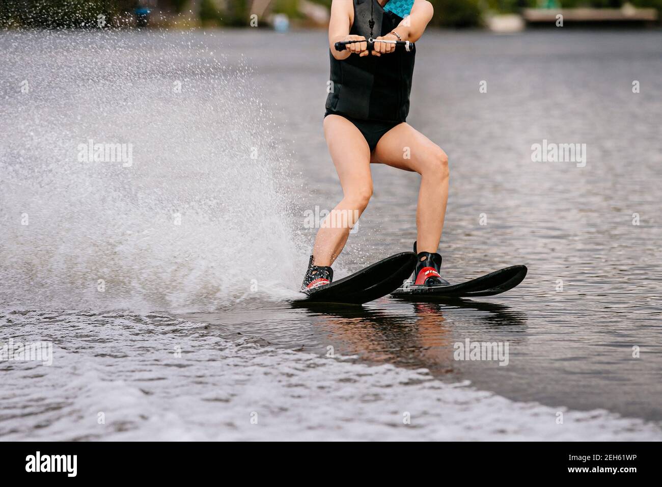 woman on water skiing in summer lake Stock Photo