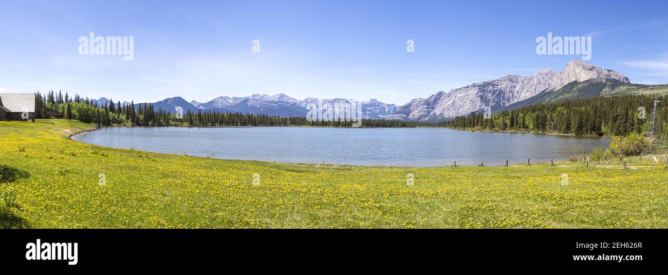 A panoramic view of a lake in Kananaskis Country west of Calgary, Alberta, Canada in the foothills of the Canadian Rockies Stock Photo